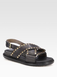 Crisscrossed leather essential with gleaming metal studs for an edgy-chic look. Rubber heel, ¾ (20mm)Leather upper with brass studsAdjustable ankle strapLeather liningRubber solePadded insoleMade in Italy