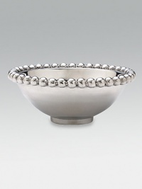 This rounded bowl in handcrafted of sandcast recycled aluminum has a pretty beaded rim. From the use of these raw materials to the design process, every step is ecologically sound, contributing to a cleaner environment. From the String of Pearls Collection 2¼H X 6D Wipe clean Imported