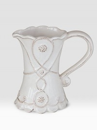 Bring the outdoors inside with a smaller, hand-finished stoneware pitcher beautifully detailed with a scrolling design that celebrates the splendor and romance of the world's most beautiful gardens. Chip resistant 5 high Dishwasher safe Imported