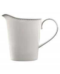 A graceful, classic shape makes this creamer the perfect complement to the Dentelle sugar bowl. From innovative designer Monique Lhullier, it features a platinum-edged tiered scallop pattern on creamy white.