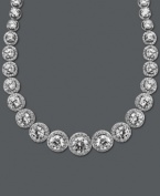 A chic collar perfect for cocktail hour. Arabella's dazzling design highlights dozens of round-cut Swarovski zirconias (55-1/3 ct. t.w.) set in sterling silver. Approximate length: 17 inches.