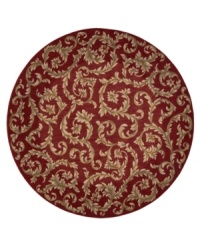 Evoking the opulence of European decor, this round rug features an elegant floral scroll pattern in gold against a rich russet ground, subtly framed in burgundy. The premium wool weave imparts rich texture and indulgent softness.