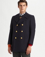 A signature winter peacoat featuring a double-breasted button closure and side slash pockets, rendered in a luxurious blend of wool and cotton for guaranteed warmth and comfort.Button-frontDouble-breastedSide slash pocketsRear ventFully linedAbout 31 from shoulder to hem56% virgin wool/44% cottonDry cleanMade in Italy