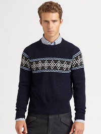 A modern style Nordic print pattern defines the body and shoulders of a cozy sweater knitted in superior wool.CrewneckRibbed knit collar, cuffs and hemWoolDry cleanImported