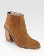 Ankle-grazing suede style with a wide, stacked heel, convenient back zipper and leather trim. Stacked heel, 3 (75mm)Suede upper with leather trimBack zipperLeather lining and solePadded insoleImportedOUR FIT MODEL RECOMMENDS ordering true whole size; ½ sizes should order the next whole size up. 