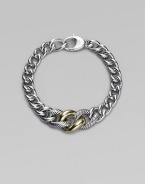 A chunky strand of graduated sterling silver links includes two with a cabled texture and one of smooth 18k gold. Sterling silver and 18k yellow gold Length, about 7½ Lobster clasp Made in Italy