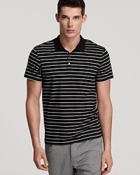 This versatile, plush cotton polo features an allover stripe pattern for an extra dimension to your casual cool wardrobe.