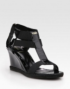 Glassy patent leather wedge enriched by rope trim, comfortable elastic straps and a goldtone nameplate. Patent leather and rope wedge, 3 (75mm)Patent leather and elastic upperLeather liningRubber solePadded insoleMade in ItalyOUR FIT MODEL RECOMMENDS ordering true size. 