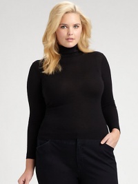 Fine-gauge Merino wool in a classic silhouette.Ribbed collarLong sleevesPullover styleAbout 25½ from shoulder to hemMerino woolDry cleanImported