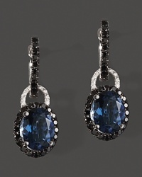 Diamonds and black diamonds circle faceted London blue topaz, set in 14K white gold.