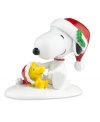 Snoopy and Woodstock play in the snow, enjoying all the magic and excitement of the holidays in this Peanuts Village figurine by Department 56.