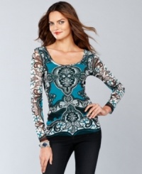 Make their heads turn with a fitted scoopneck top from INC. Shimmering sequins add sparkle to an appealing exotic print.