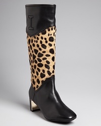 Isaac Mizrahi New York lends exotic appeal to these low heeled, kittenish boots with leopard-print, calf hair shafts. Add a wild touch to your work wardrobe.