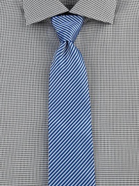 Bold stripes in oceanic hues define this timeless style of fine Italian cotton. CottonDry cleanMade in Italy