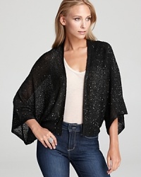 This graceful open weave cardigan from DKNYC features shimmering sequin embellishment to brighten up an LBD or basic tank.