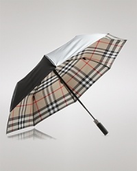 A tonal check pattern lining undergirds this protective umbrella, shading you in signature Burberry style while repelling the rain.