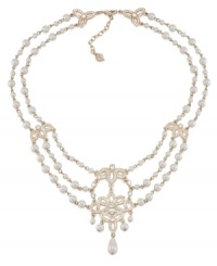 A true dazzler. Embellished with glittering stone accents and glass pearls, you'll strike a chord in this swag frontal necklace from Carolee. Crafted in gold tone mixed metal. Approximate length: 17 inches + 2-inch extender.