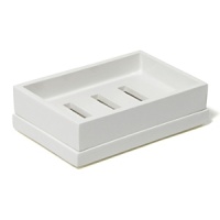 Sleek and sophisticated in cool white, these hand-lacquered bath accessories brighten any bathroom.