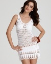 This beautiful crochet sheath dress from Nanette Leporte gives more than a hint of the suit beneath.