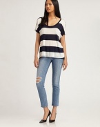 Boldly striped scoopneck of soft jersey has short dolman sleeves and a trend-forward hi-low hem. ScoopneckDropped shouldersShort dolman sleevesHi-low hemRayonDry cleanMade in USAModel shown is 5'10 (177cm) wearing US size Small.