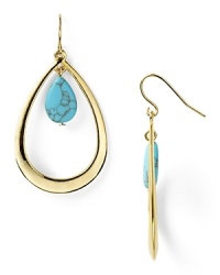 A bright turquoise stone floats in a shining gold-plated teardrop in these elegant earrings from Lauren Ralph Lauren.