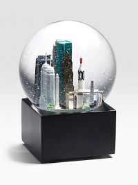 EXCLUSIVELY OURS. The musical Houston globe showcases landmark sites including:  NASA, the financial building, San Jacinto monument, Williams Tower and more.  Plays Deep In The Heart of Texas.  6 high.  Imported Glass globe, resin figures.