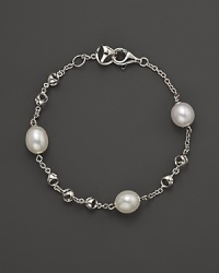 A bold sterling silver and freshwater pearl chain bracelet. By Di MODOLO.