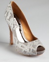 In patterned, metallic silk, Badgley Mischka's dressed up Roxie pumps showcase a luxe look.