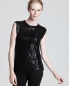 Sport shine this season in a shimmery Edun sleeveless sweater and top off streamlined skinnies with on-trend fall flair.