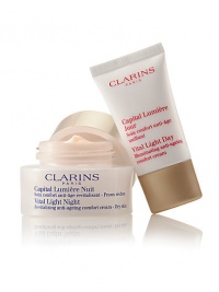 Clarins' exclusive pioneer plant extracts help defy dark spots, dullness and wrinkles for a smooth, unified skin tone. Visibly lifts, firms and restores the deep luminosity of young-looking skin. Duo includes: Full-size Vital Light Night Revitalizing Anti-Aging Cream and travel-size Vital Light Day Illuminating Anti-Aging Cream. Made in France. 