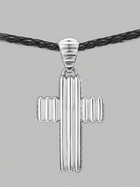 A ridged cross pendant crafted in polished silver hangs from a woven cord of soft leather. From the Bedeg Collection Silver Leather Pendant, 1W X 2¼H Necklace, adjustable 26-28 Lobster clasp Imported 