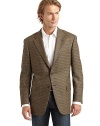 THE LOOKAllover tweed constructionNotched lapelWelt pocket at chestButton closureDual flap pocketsLong sleeves with button cuffsVented back hemInner welt pocketsTHE FITAbout 31 from shoulder to hemTHE MATERIALWorsted woolFully linedCARE & ORIGINDry cleanMade in USA