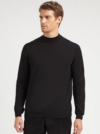 A sophisticated layer with a ribbed mockneck collar in soft merino wool.Ribbed mockneck collarLong sleeves with ribbed cuffsRibbed hemMerino woolDry cleanImported