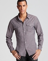 Front and back darts help shape the silhouette of this handsome button-down for a slimmer fit, and a solid, understated color provides versatility.