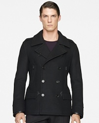 Sophisticated and sleek, this handsome pea coat in warm wool exudes modern luxury in a trim silhouette with supple leather trim.