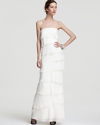 Tiers and tiers of rich silk decorate this Nicole Miller strapless gown for an ethereal look.