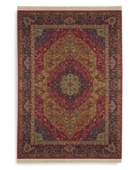 Inspired by the distinctive and beautiful textiles of the Kirman region in ancient Persia, this rug features a curvilinear medallion design upon a field embellished with arabesques and floral motifs. Patterned after a nineteenth-century Kirman rug, it makes use of borders to showcase a spectrum of colors such as indigo blue, brick reds, tobacco golds, browns and olives - with a smattering of soft aqua, coral and burgundy. Each color is specially dyed for a timeworn striated effect that recreates the antique beauty of the original. Woven in the USA of luxuriously soft premium worsted New Zealand wool.