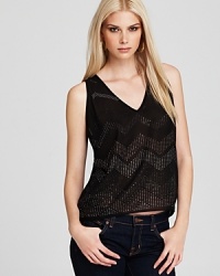 Allover studs sparkle on this GUESS top for a laid-back take on after-dark chic.