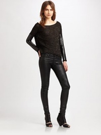 Shapely style with rich, leather-like sleeves and a shimmery knit body with a contoured hem. BoatneckDropped shouldersLong faux leather sleeves with knit cuffsContour cropped front hem with faux leather bandFully linedBody: 90% acetate/10% LurexTrim: polyesterDry cleanMade in USAModel shown is 5'10 (177cm) wearing US size Small.