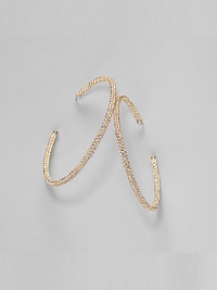 EXCLUSIVELY AT SAKS. Delicate yet dazzling, these brilliant hoops are encrusted with crystals. 18k goldplated Diameter, about 2¼ Stainless steel post back Imported