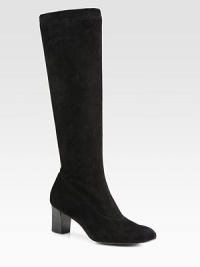 Rich suede forms this tall staple resting on a stacked wooden heel. Stacked heel, 2½ (65mm)Shaft, 16½Leg circumference, 12½Suede upperLeather lining and solePadded insoleImported