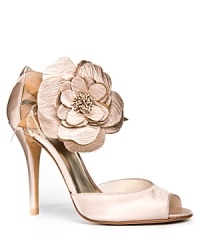 An oversized flower adorns the ankle strap of Stuart Weitzman's statement-making Bodabing pumps.