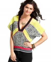 Give your day style a dose of global flavor with a kimono-style top that mixes tribal graphics with bold blocks of color! From Rampage.