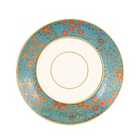 The luxurious, museum-quality floral motifs in Gilded Tapestry create a dramatic presentation sure to command attention at any dinner party. Warm ember hues and golden tones are offset by cool blue accents on this compelling pattern. Unique layering of of each place setting piece atop the other highlights the common threads of color and metallics while creating a sophisticated style.