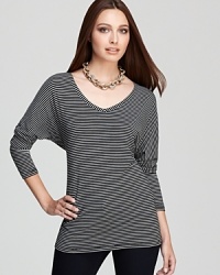 Sharp stripes adorn an effortless Isaac Mizrahi Jeans top, flaunting generous dolman sleeves for modern impact.