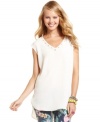 Neutral tones and muted embellishments make this sleeveless One Clothing top the perfect match for a pair of fun skinnies!