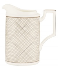 Dressed in a fine diamond grid of bronze and warm taupe, this creamer is tailored for formal dining and everyday elegance. A hooked handle architects a unique silhouette to enhance more classic bone china essentials. From Noritake's collection of serveware and serving dishes.