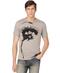 A cool graphic of an eye with a skull pupil and trance printed above, gives this Calvin Klein Jeans tee its edgy artsy style.