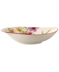 Prolong spring with this deep Mariefleur serving bowl. Splashy colors adorn premium white porcelain edged in red and crafted in a whimsical leaf shape. Mix and match with New Cottage dinnerware, also by Villeroy & Boch.