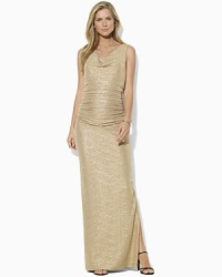 A draped cowl neckline imparts chic, sophisticated style to an elegant evening gown, tailored from softly crinkled jersey with glistening metallic specks for an eye-catching appeal.